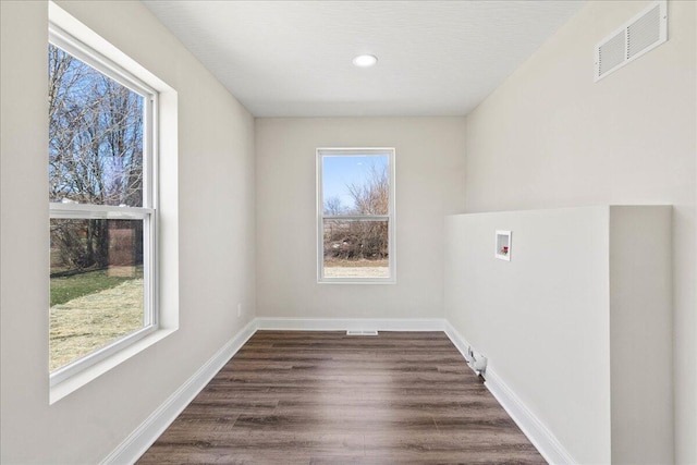 laundry area with washer hookup, laundry area, visible vents, and a wealth of natural light