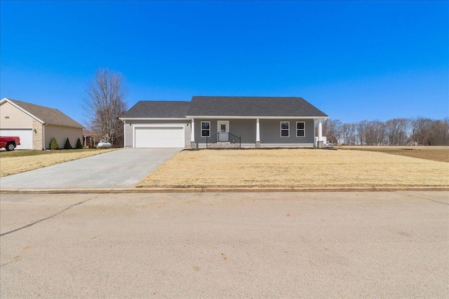 ranch-style home featuring a front lawn, concrete driveway, and a garage