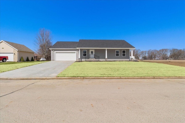 view of front of home with driveway, an attached garage, and a front lawn