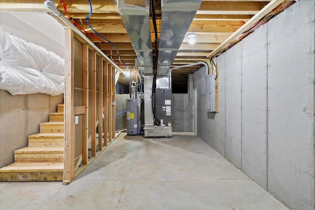 unfinished below grade area with water heater, heating unit, stairway, and electric panel