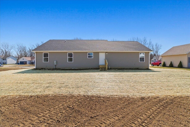 rear view of house with entry steps