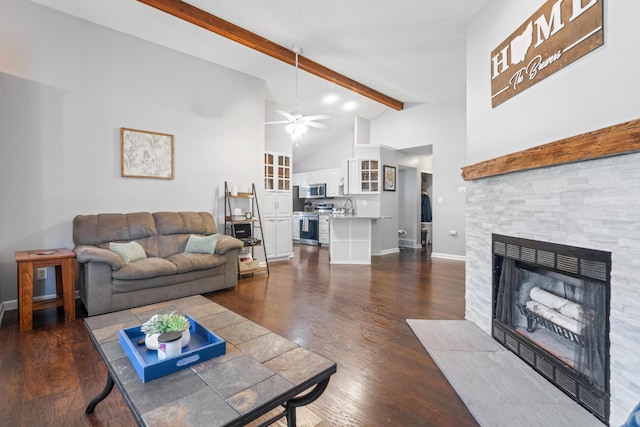 5175 Locust Post Ln, Columbus, OH 43230 - living area featuring beam ceiling, a fireplace, a ceiling fan, dark wood-type flooring, and high vaulted ceiling