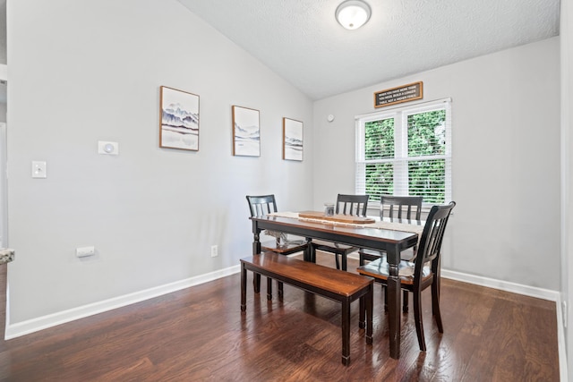 5175 Locust Post Ln, Columbus, OH 43230 - dining area featuring lofted ceiling, dark wood-style flooring, and a textured ceiling