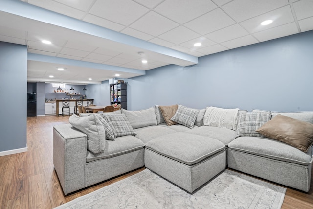 5175 Locust Post Ln, Columbus, OH 43230 - living area featuring wood finished floors, a paneled ceiling, and bar