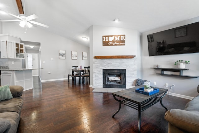 5175 Locust Post Ln, Columbus, OH 43230 - living room featuring lofted ceiling, ceiling fan, dark wood-type flooring, and a stone fireplace