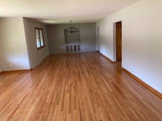 unfurnished living room with hardwood / wood-style floors