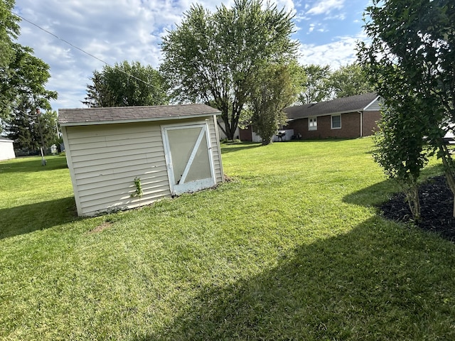 5151 Pheasant St, Lima, OH 45807 - view of green lawn featuring a storage shed