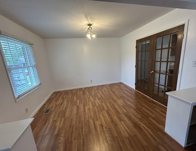 5151 Pheasant St, Lima, OH 45807 - unfurnished dining area featuring french doors and dark wood-style flooring