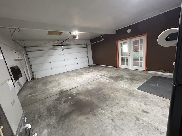 5151 Pheasant St, Lima, OH 45807 - garage with french doors and a garage door opener