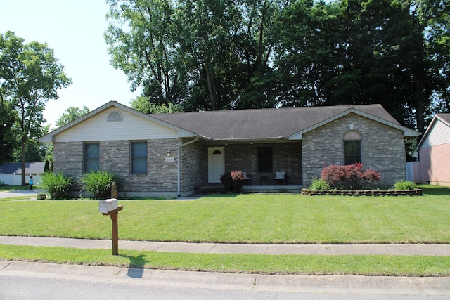 108 Esther Dr, Lewisburg, OH 45338 - single story home featuring brick siding, a front yard, a porch, and a shingled roof