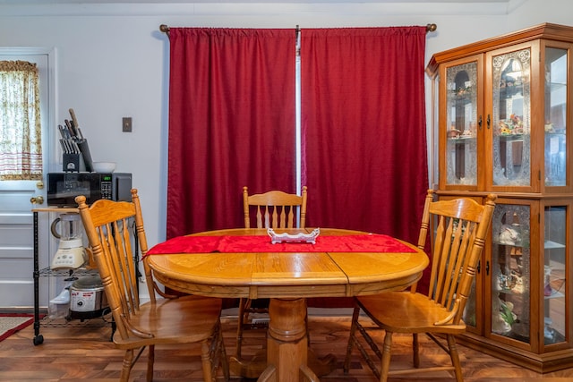 dining room with parquet flooring