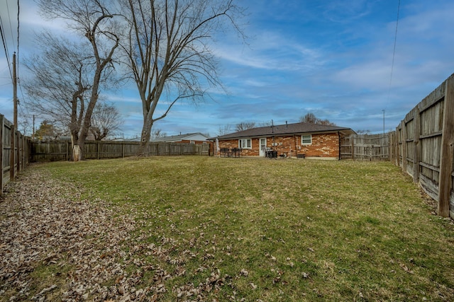 view of yard with a fenced backyard