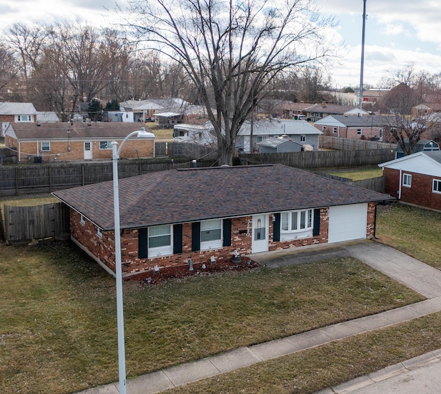 ranch-style house featuring a residential view, a front lawn, and brick siding