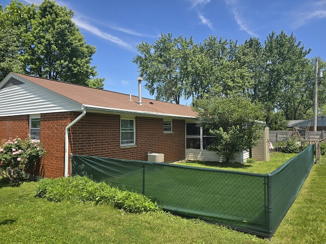 1006 Mayfield Dr, Troy, OH 45373 - rear view of house with brick siding