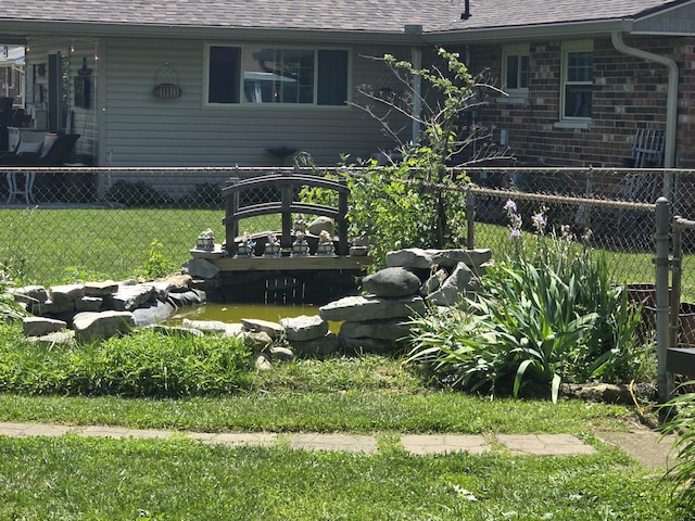 1006 Mayfield Dr, Troy, OH 45373 - view of yard with a garden pond