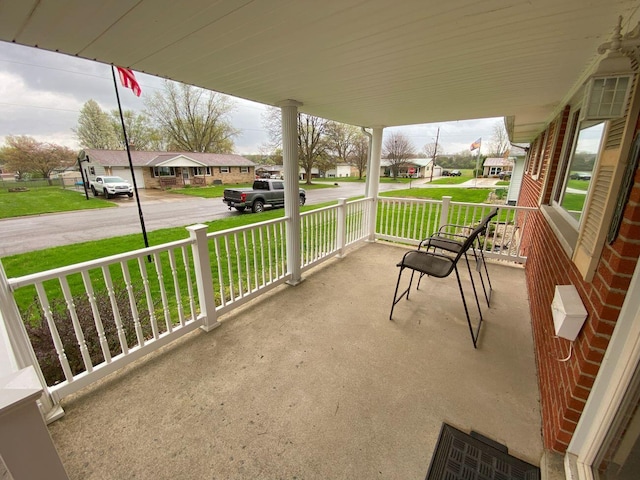 view of patio / terrace featuring a residential view and a porch