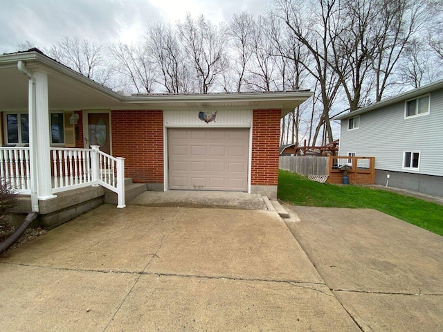 exterior space with concrete driveway, brick siding, a porch, and a garage