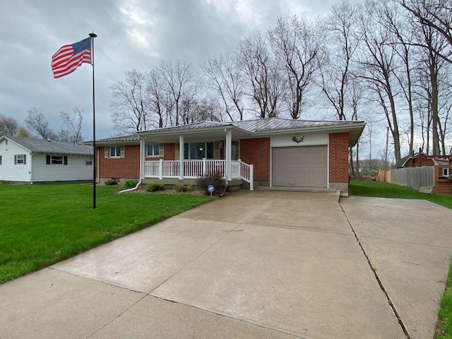 single story home with driveway, covered porch, brick siding, an attached garage, and a front yard