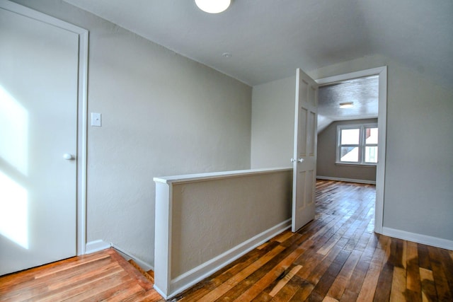 422 New St, Sidney, OH 45365 - corridor with hardwood / wood-style floors, a textured ceiling, and vaulted ceiling