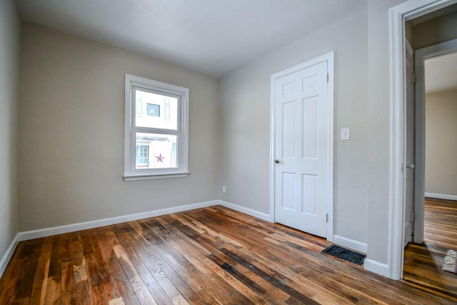 422 New St, Sidney, OH 45365 - unfurnished bedroom with dark hardwood / wood-style flooring
