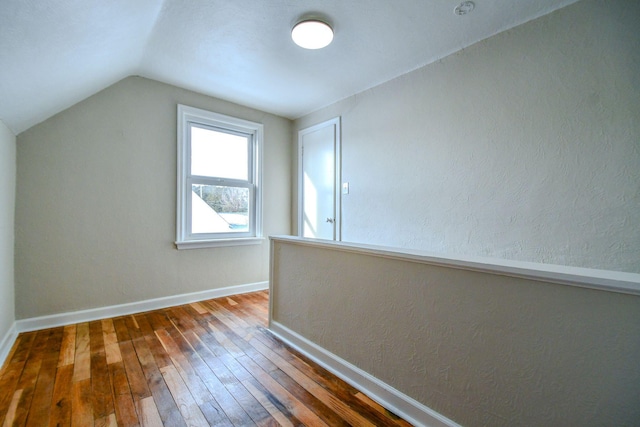 422 New St, Sidney, OH 45365 - additional living space with dark wood-type flooring and vaulted ceiling