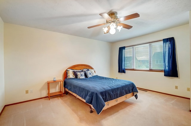 bedroom with a ceiling fan, carpet, visible vents, and baseboards