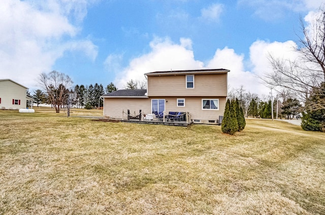 back of property featuring a lawn and a wooden deck