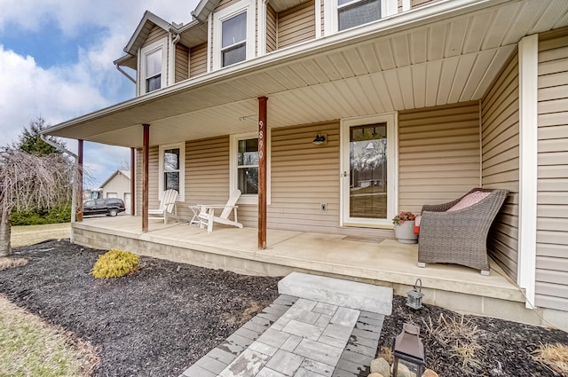 entrance to property featuring covered porch