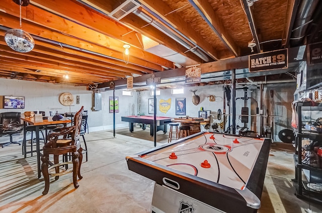 game room featuring concrete flooring, pool table, and electric panel