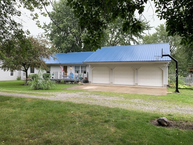 6645 Oak Dr, Celina, OH 45822 - ranch-style house featuring dirt driveway, a metal roof, an attached garage, and a porch