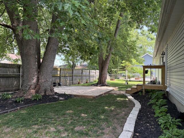 6645 Oak Dr, Celina, OH 45822 - fenced backyard with a patio area