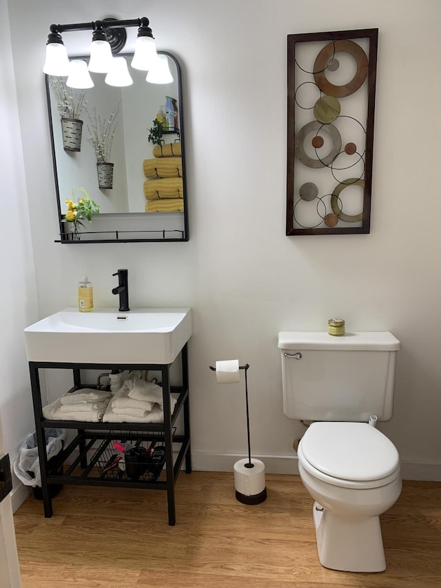 6645 Oak Dr, Celina, OH 45822 - half bath featuring wood finished floors and vanity