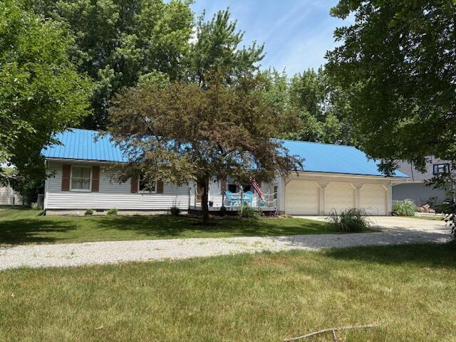 6645 Oak Dr, Celina, OH 45822 - view of front of property with a front yard, driveway, and a garage