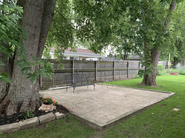 6645 Oak Dr, Celina, OH 45822 - fenced backyard with a patio area