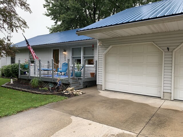 6645 Oak Dr, Celina, OH 45822 - view of front of home with a metal roof and concrete driveway