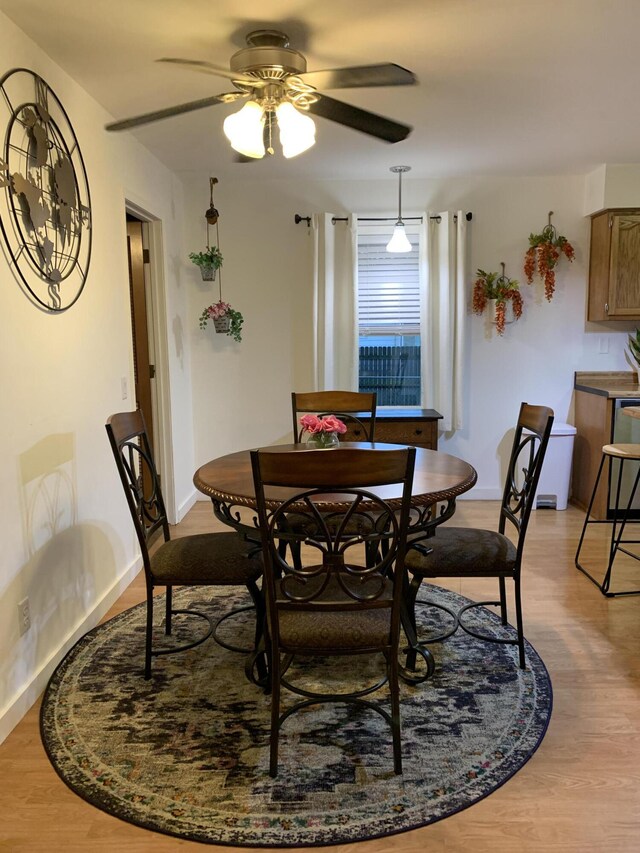 6645 Oak Dr, Celina, OH 45822 - dining area featuring ceiling fan and light wood-style floors