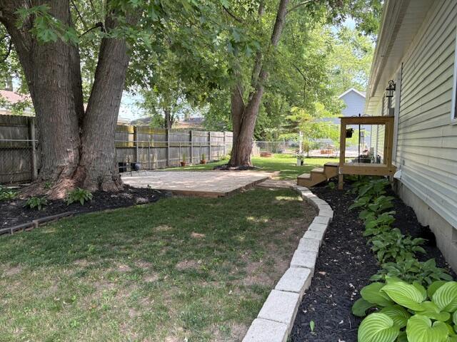 6645 Oak Dr, Celina, OH 45822 - fenced backyard with a patio area