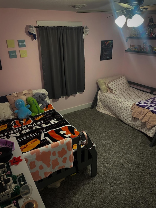 carpeted bedroom featuring baseboards