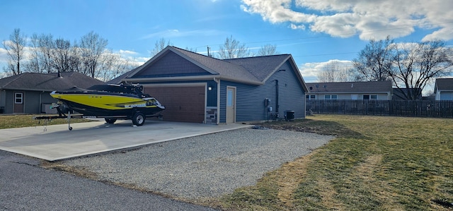 view of side of home featuring an attached garage, cooling unit, fence, driveway, and a lawn