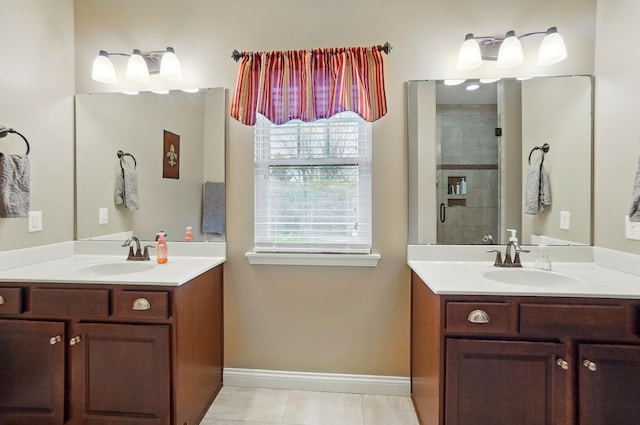 full bath with tile patterned floors, two vanities, and a sink