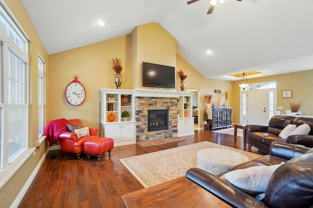 living room with baseboards, a fireplace, dark wood finished floors, ceiling fan, and high vaulted ceiling