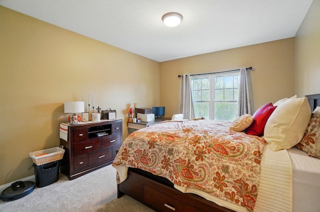 bedroom with carpet flooring and baseboards