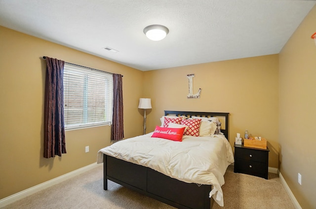bedroom featuring light carpet, visible vents, and baseboards