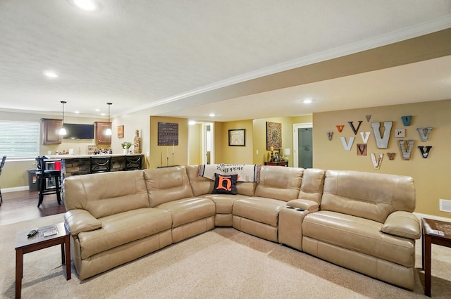 living area with light carpet, bar area, and recessed lighting