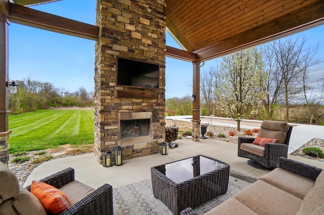 view of patio / terrace with an outdoor living space with a fireplace