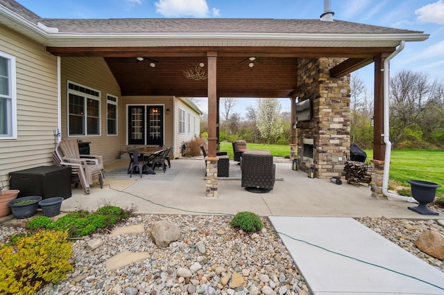 view of patio featuring an outdoor fireplace
