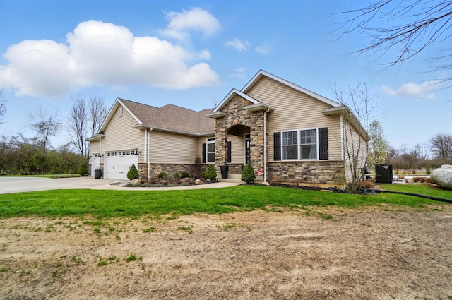 craftsman-style home featuring a front lawn, stone siding, a garage, and driveway
