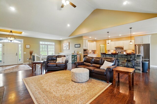 living room featuring dark wood-type flooring, high vaulted ceiling, ceiling fan, and recessed lighting