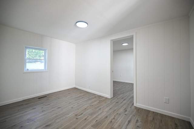 8095 N Lena-Palestine Rd, Conover, OH 45317 - unfurnished room with wood finished floors and baseboards