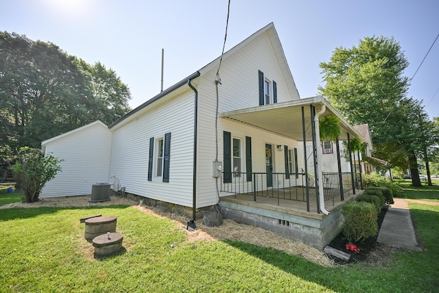 8095 N Lena-Palestine Rd, Conover, OH 45317 - view of side of home featuring a porch and a lawn